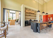 Thumbnail 9 of 59 - a kitchen with an island and stools in a 555 waverly unit at Avery Ranch, Texas