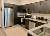 Thumbnail 20 of 52 - Granite Counters & Stainless Steel Appliances at Delco Flats, Austin, 78717