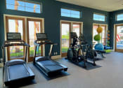 Thumbnail 40 of 52 - a gym with treadmills and other exercise at Delco Flats, Austin Texas