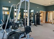 Thumbnail 39 of 52 - a gym with weights and other exercise equipment at Delco Flats, Austin, 78717