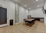 Thumbnail 46 of 140 - Community room with kitchenette at Matador Apartments, Texas