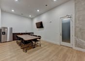 Thumbnail 49 of 140 - Community room with dining table at Matador Apartments, Texas, 78745