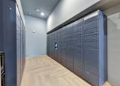 Thumbnail 44 of 140 - Package locker room with secure storage compartments at Matador Apartments, Austin, TX