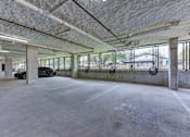 Thumbnail 51 of 140 - Covered parking garage with concrete columns at Matador Apartments, Austin