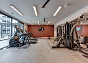 Thumbnail 63 of 140 - Fitness center with cardio and strength training equipment at Matador Apartments, Austin