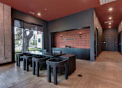 Thumbnail 33 of 140 - Lobby seating area with modern furniture and reception desk at Matador Apartments, Austin, TX 78745