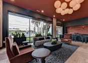 Thumbnail 35 of 140 - Modern lobby lounge with fireplace and dining area at Matador Apartments, Austin, 78745