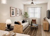Thumbnail 35 of 46 - A living room with a white couch, a coffee table, and a ceiling fan.
