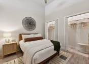 Thumbnail 9 of 44 - A spacious bedroom with queen size bed and large closet at Bridge at Windsor Park