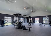 Thumbnail 8 of 55 - A spacious gym with a variety of equipment.