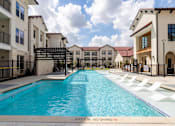 Thumbnail 11 of 55 - A swimming pool in a residential area with a depth marker indicating 4 feet 6 inches.