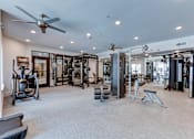 Thumbnail 20 of 51 - A spacious home gym with a variety of exercise equipment.