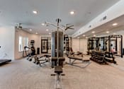 Thumbnail 22 of 51 - A spacious home gym with a variety of equipment.