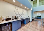 Thumbnail 18 of 80 - A kitchen with a deer head mounted on the wall.
