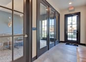 Thumbnail 39 of 80 - A room with a glass door leading to a balcony.