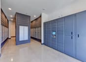Thumbnail 43 of 80 - A row of blue lockers are lined up in a room.