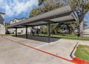 Thumbnail 49 of 80 - A parking lot with a red line painted on the ground.