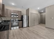 Thumbnail 33 of 39 - A modern kitchen with wooden cabinets and stainless steel appliances.