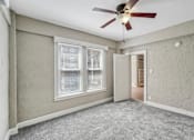 Thumbnail 40 of 66 - A room with a ceiling fan and a window.