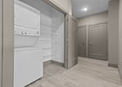 Thumbnail 30 of 39 - A kitchen with a white fridge and wooden floors.