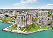 Thumbnail 66 of 66 - A large building sits on a pier over water.