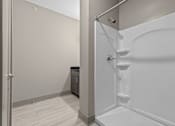 Thumbnail 22 of 39 - A white bathroom with a walk-in shower.