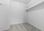 Thumbnail 40 of 40 - A room with a ceiling fan and a door on the right side.