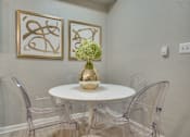 Thumbnail 11 of 57 - A dining room with a white table and chairs.
