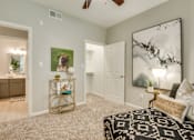 Thumbnail 40 of 57 - A bedroom with a large bed and a painting on the wall.