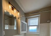 Thumbnail 19 of 66 - a bathroom with a sink toilet and a bath tub
