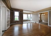 Thumbnail 24 of 66 - Living/Dining room with hard wood floors and carpeted reading nook.