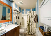 Thumbnail 31 of 47 - a bathroom with a shower toilet and sink and a mirror at Ann Arbor City Club, Ann Arbor, 48104