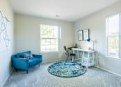 Thumbnail 17 of 17 - a home office with a blue chair and a white desk