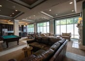 Thumbnail 5 of 22 - Club room at Residences of Creekside with brown leather couches and pool table.