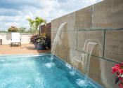 Thumbnail 9 of 22 - Waterfalls in the pool at the Residences of Creekside.