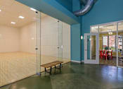 Thumbnail 17 of 20 - a room with a glass shower and a wooden bench at Village Club of Royal Oak, Royal Oak, 48067