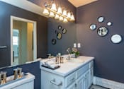 Thumbnail 6 of 20 - a bathroom with a sink and a mirror at Village Club of Royal Oak, Royal Oak, MI 48067
