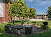 Thumbnail 15 of 20 - a park with benches and trees in front of a building at Village Club of Royal Oak, Michigan, 48067