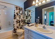Thumbnail 5 of 20 - a bathroom with a sink and a toilet and a shower at Village Club of Royal Oak, Royal Oak, 48067