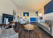 Thumbnail 1 of 20 - a living room with blue and white walls and a couch at Village Club of Royal Oak, Michigan