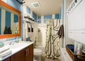 Thumbnail 35 of 47 - a bathroom with a sink toilet and shower and a mirror at Ann Arbor City Club, Ann Arbor, MI 48104