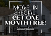 Thumbnail 17 of 40 - A house with a sign offering a free month for a move-in special.