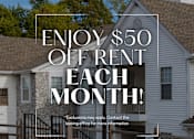 Thumbnail 26 of 26 - A house with a sign offering $50 off rent each month.