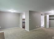 Thumbnail 2 of 16 - Dining room with gray walls and plush carpeting