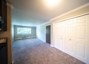 Thumbnail 3 of 17 - Dining area overlooking living room with closet doors