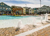 Thumbnail 8 of 37 - A pool with a fountain in the middle of it.