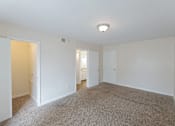 Thumbnail 37 of 47 - A room with white walls and carpeted floor.