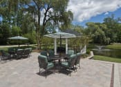 Thumbnail 12 of 16 - Patio furniture on deck overlooking pond
