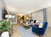Thumbnail 4 of 18 - a living room with a couch and a table