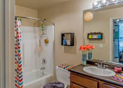 Thumbnail 15 of 16 - Bathroom with orange decor
